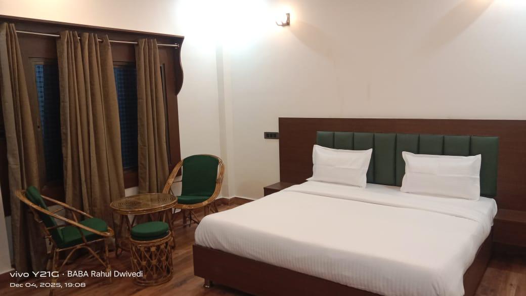 Luxury resort pool with palm trees at sunset